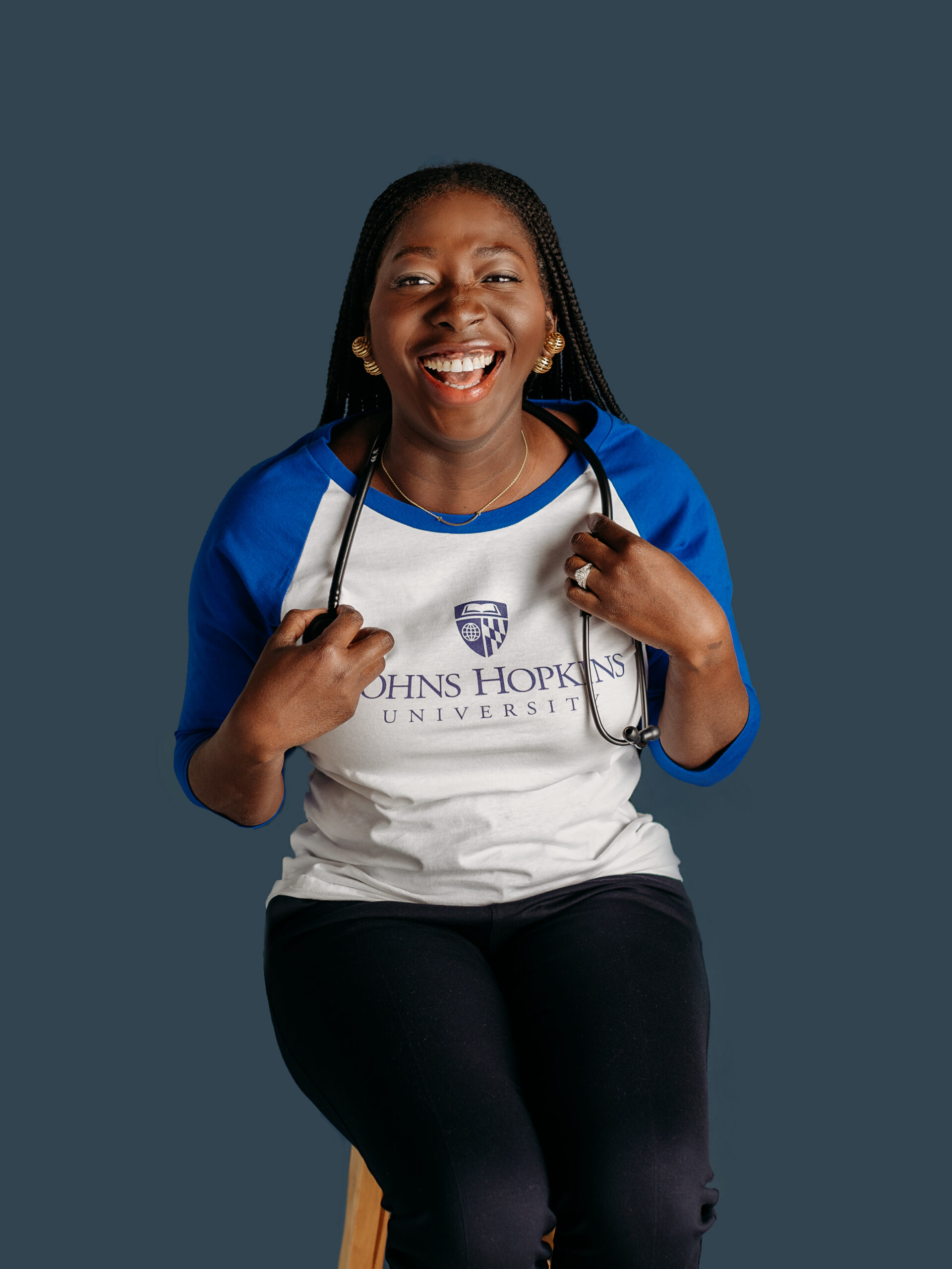 Casual professional headshot with blue backdrop in Barrington, Illinois studio.