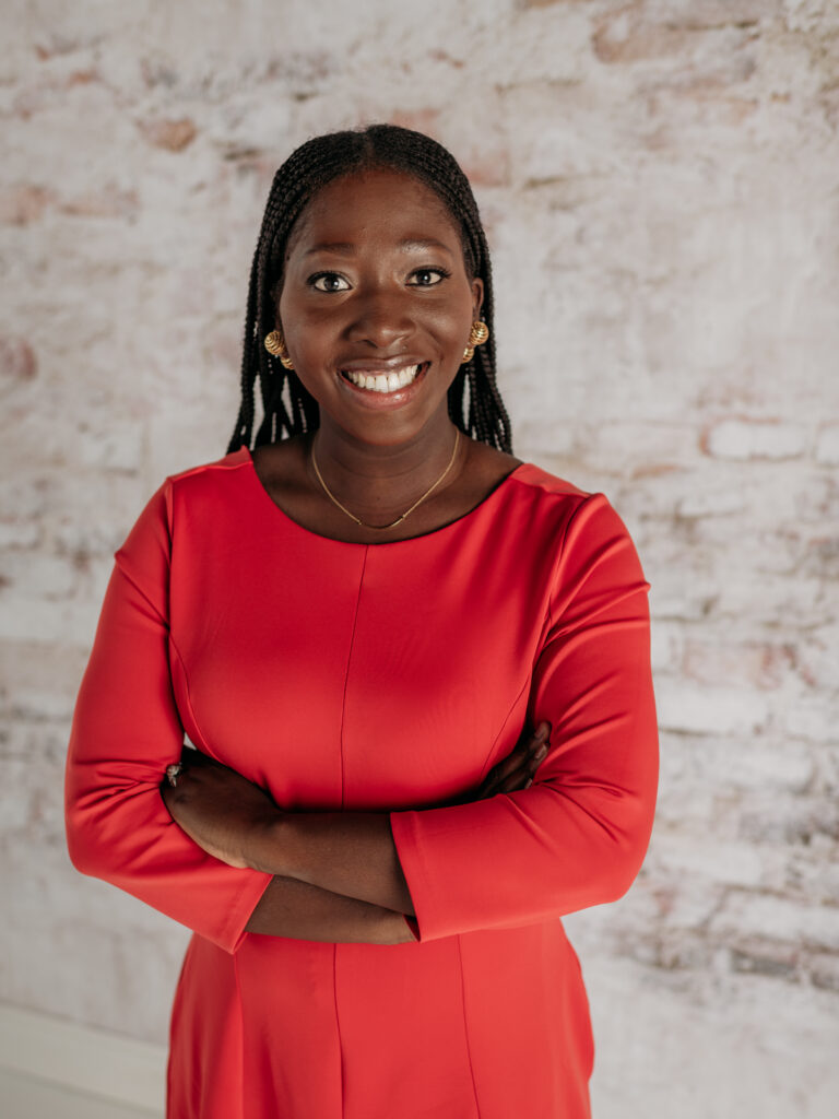 Female corporate headshot in red dress photographed in Barrington, Illinois studio.